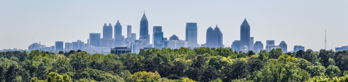 A city skyline with trees.