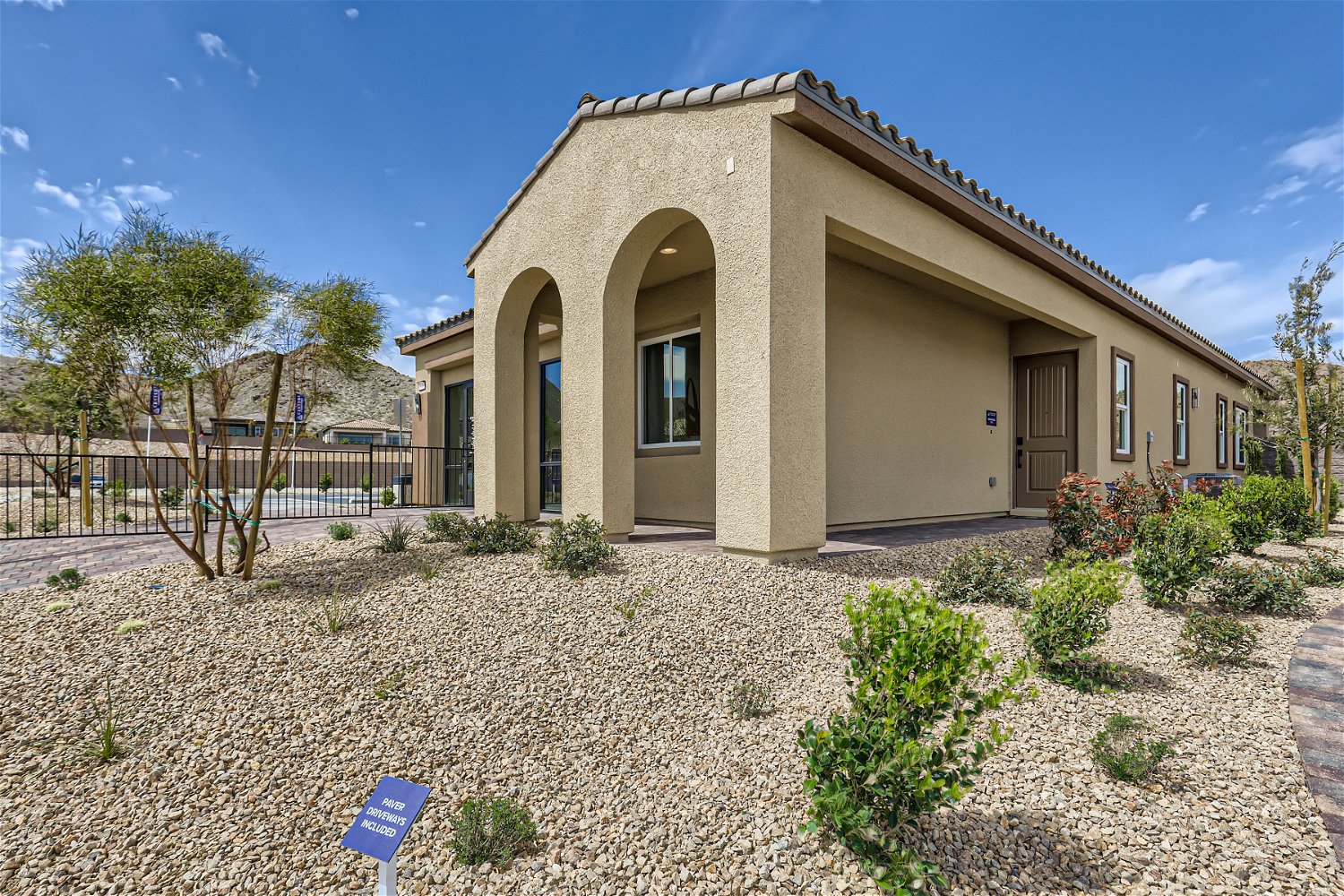 A building with a large front yard.