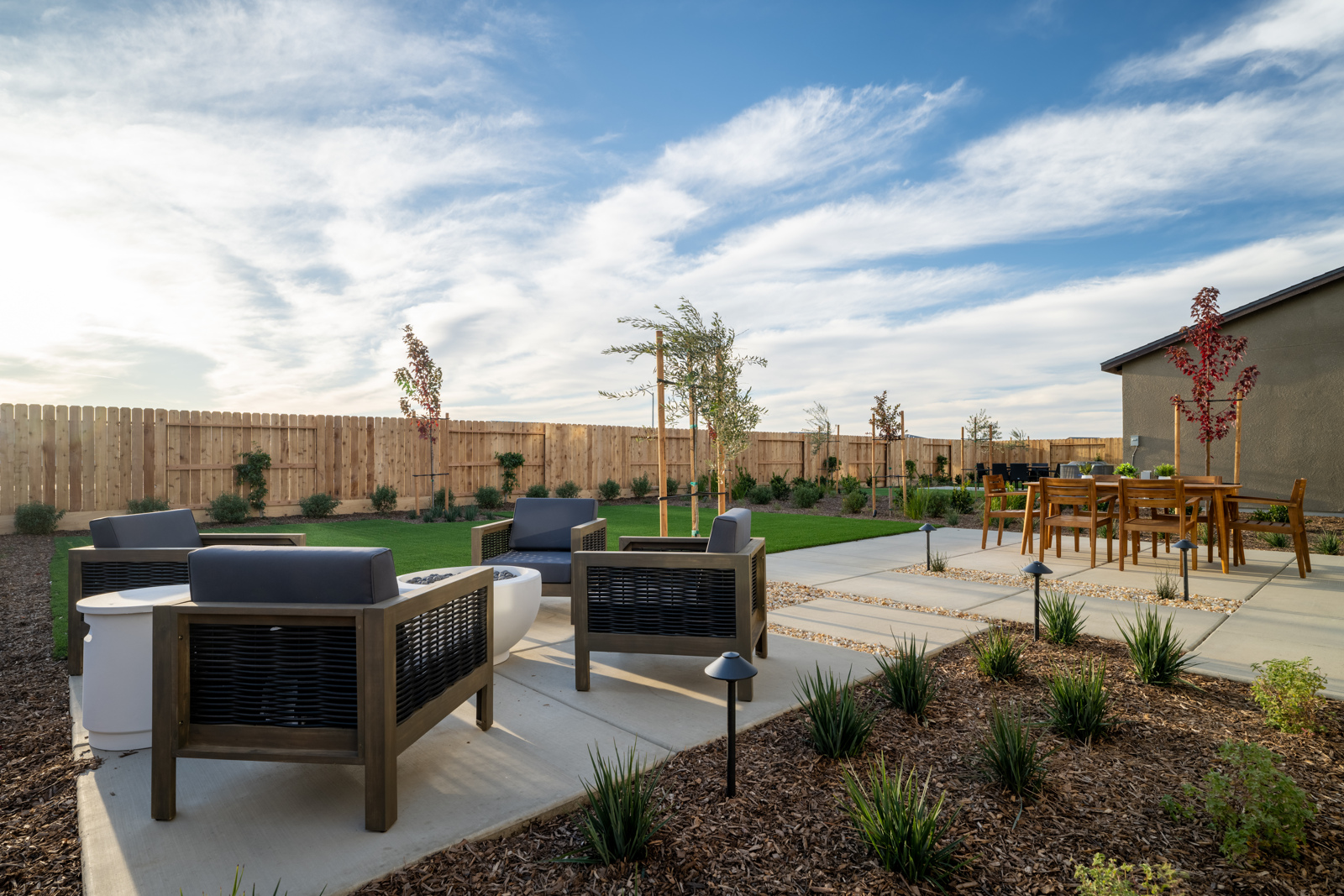 A courtyard with benches and tables.