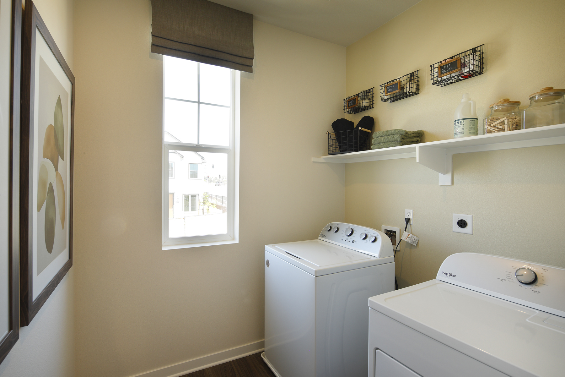 A laundry room with a washer and dryer.