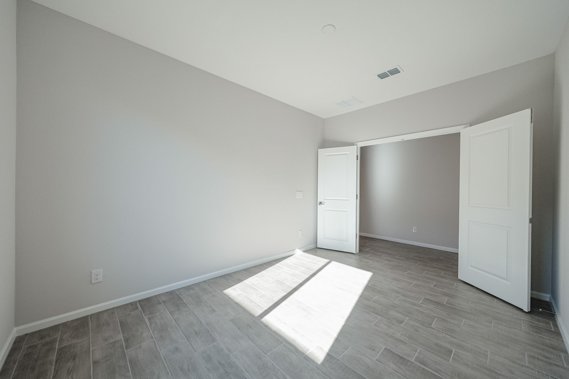 A room with white doors.