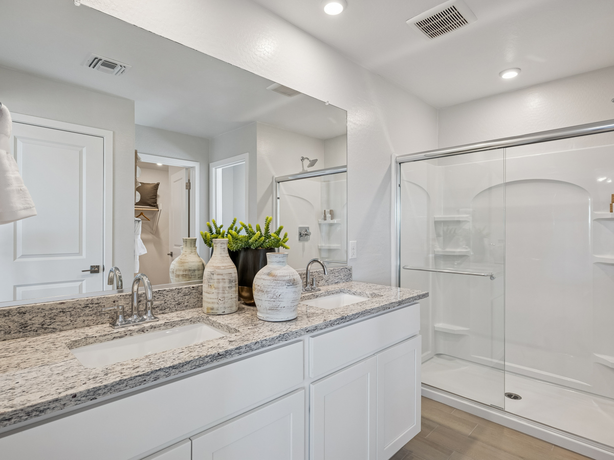 A bathroom with a marble countertop.
