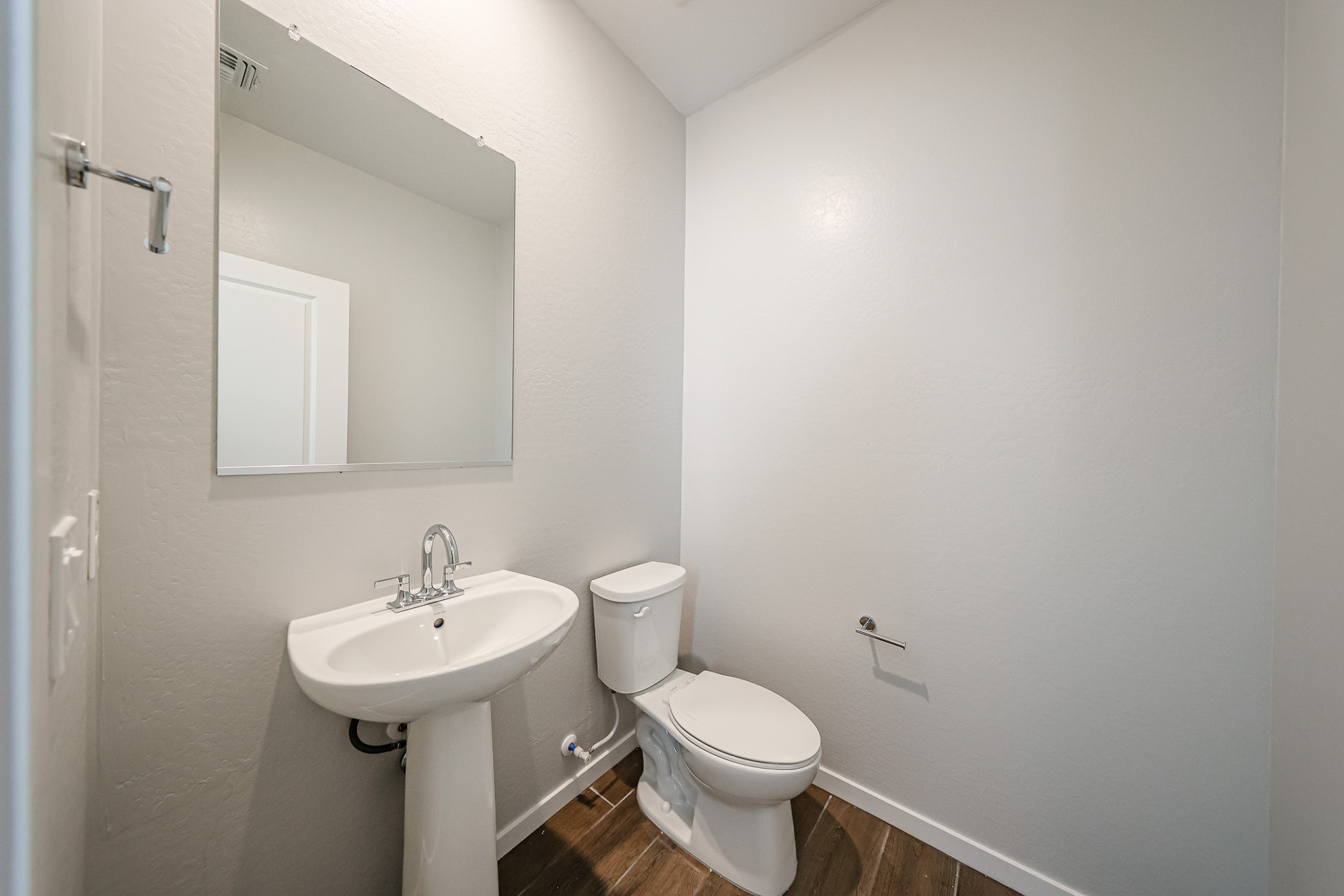 A bathroom with a toilet and sink.
