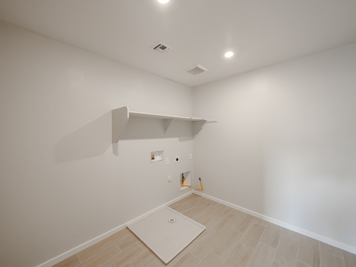 A room with a white wall and a white floor.