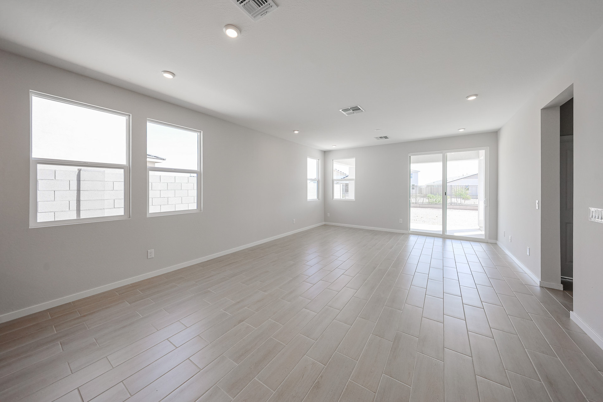 A large empty room with windows.