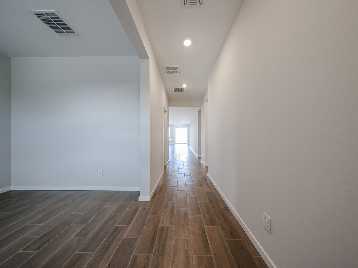 A hallway with white walls.