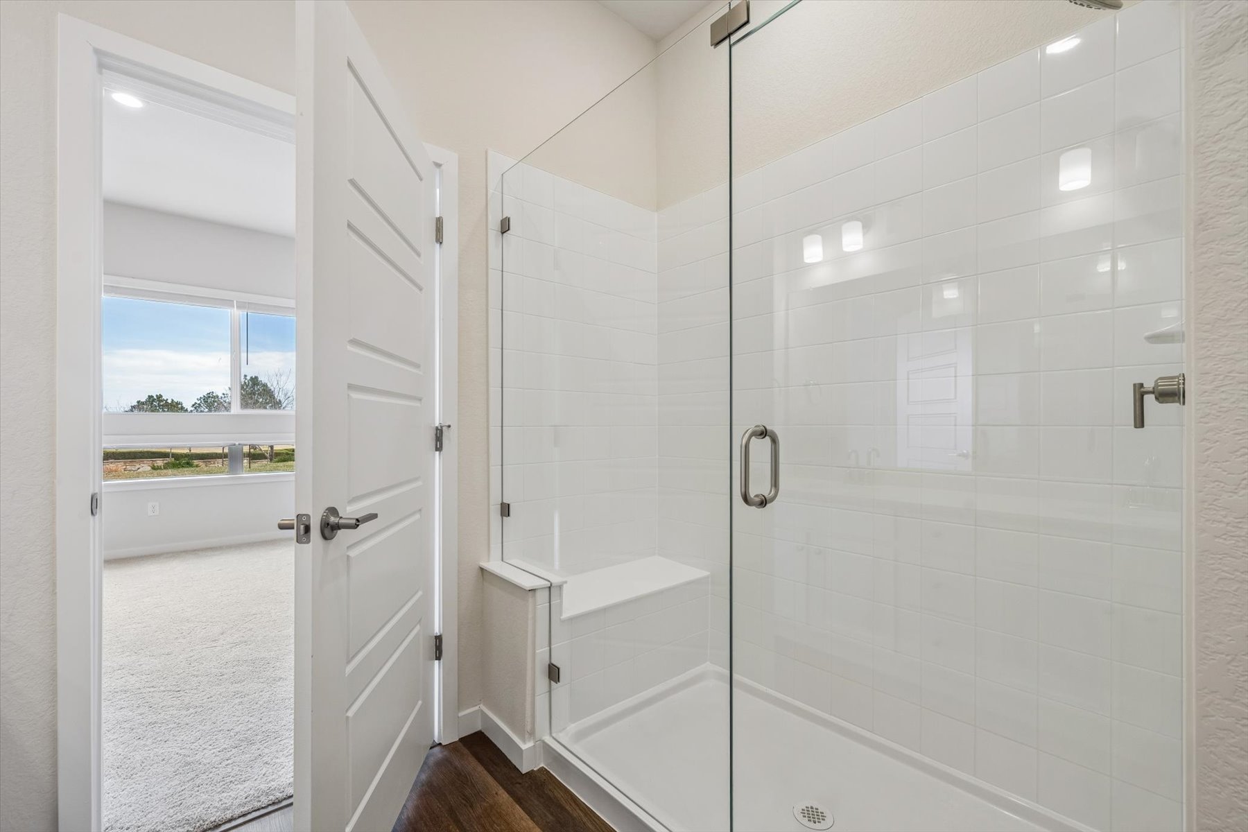 A bathroom with a glass shower.
