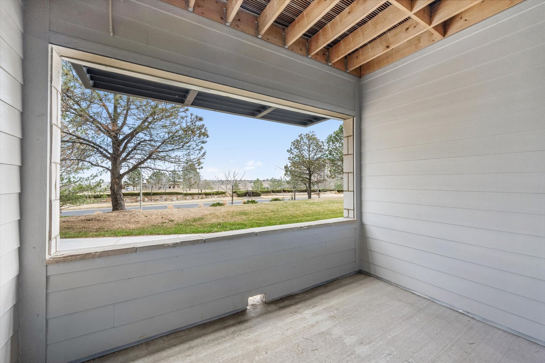 A view of a yard through a window.