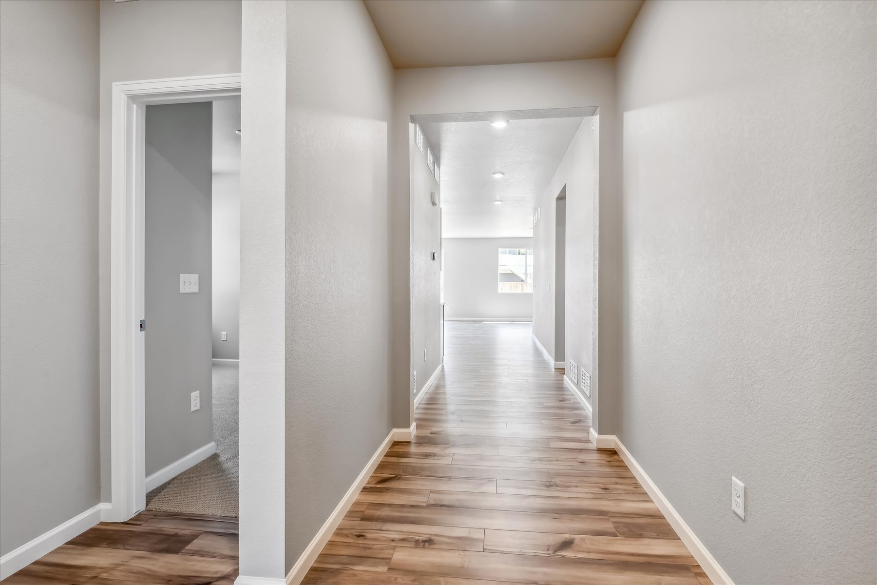 A hallway with white walls.