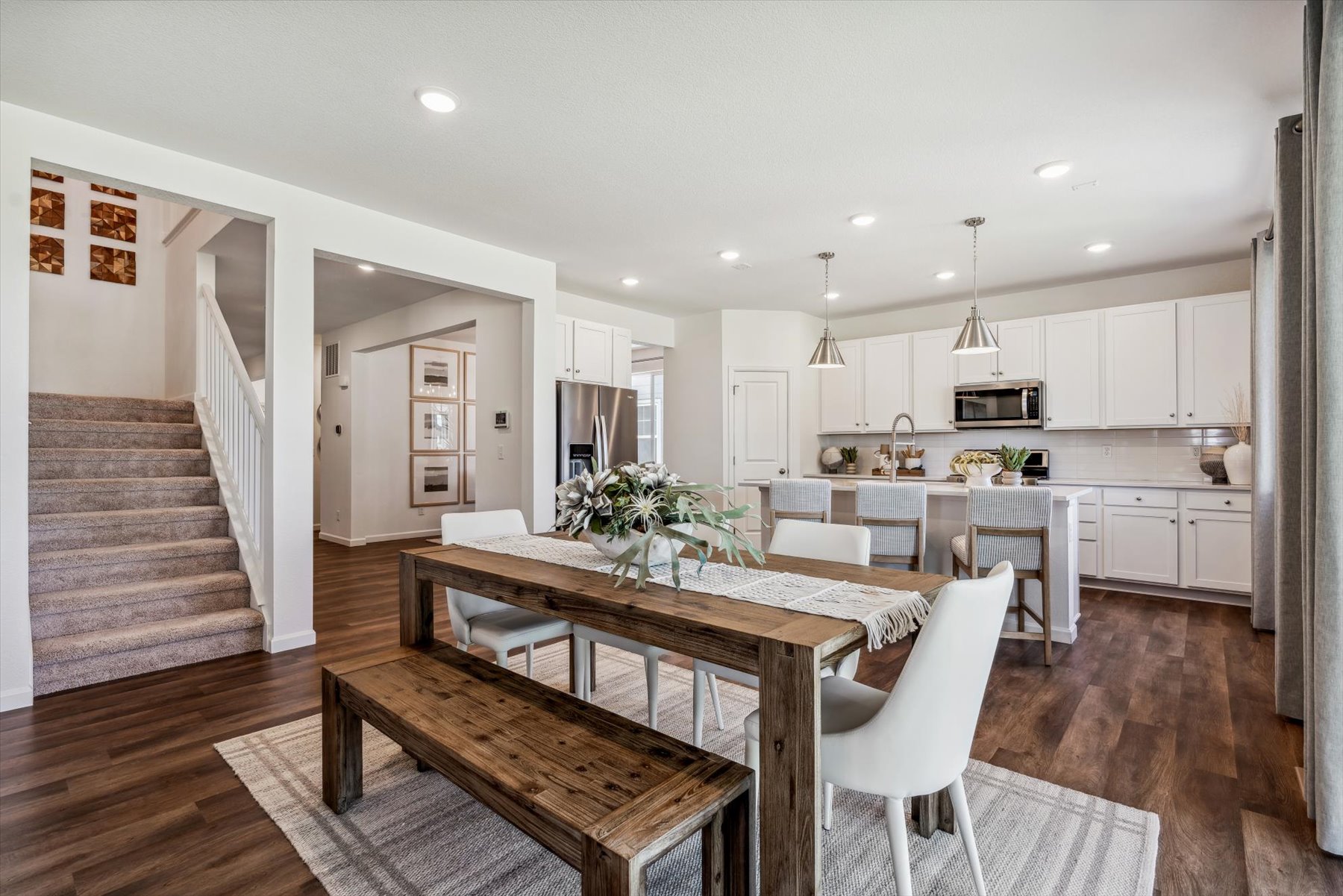 A kitchen with a dining table.