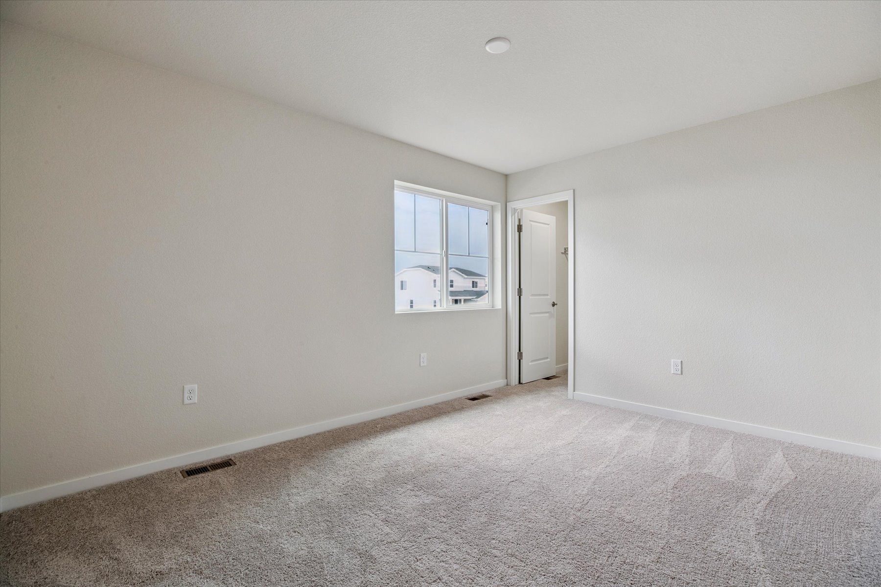 A room with a door and a window.