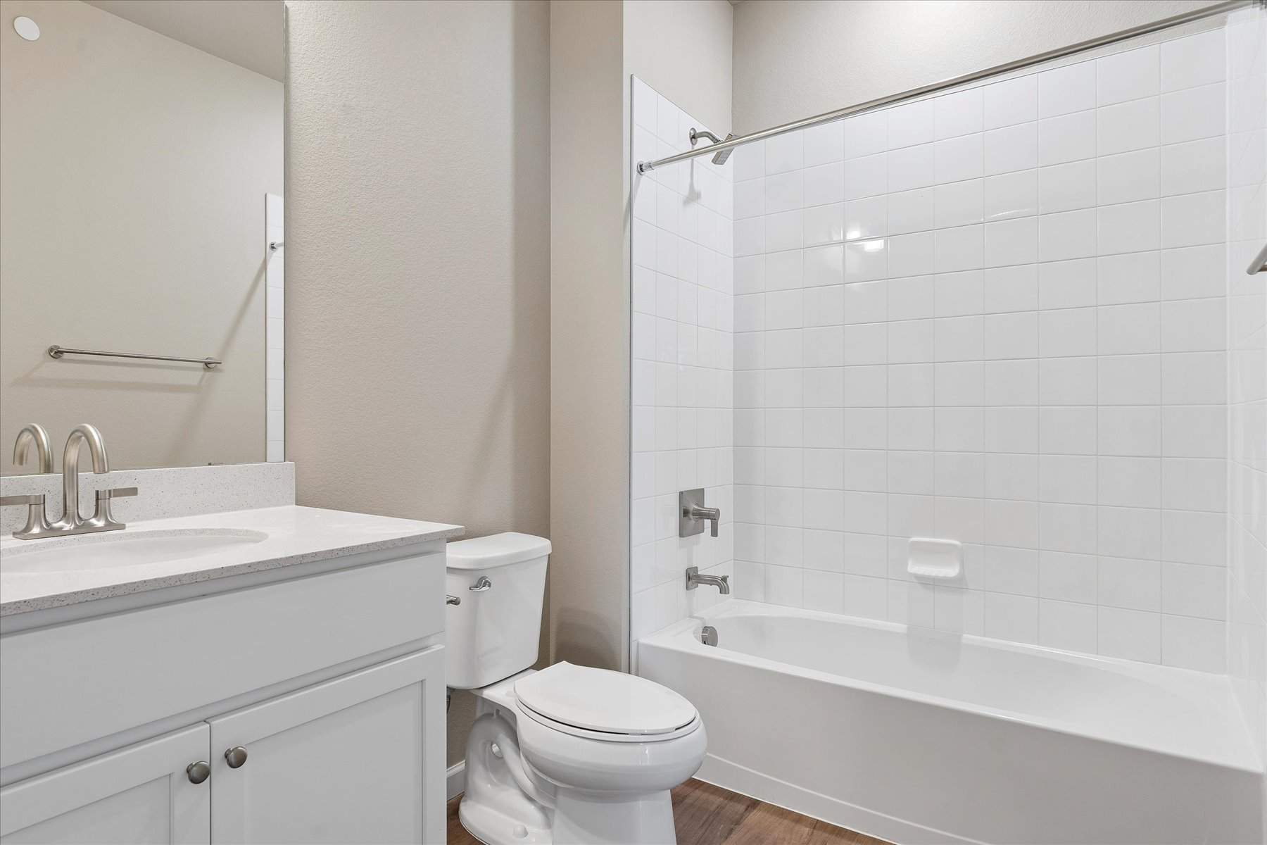 A bathroom with a toilet and sink.