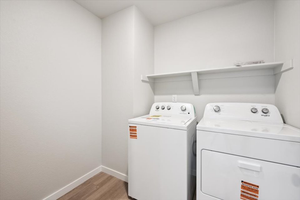 A laundry room with a washer and dryer.