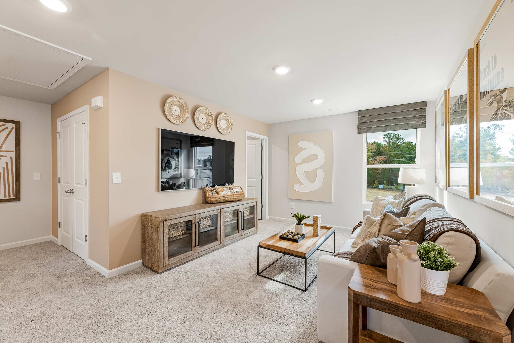 A living room with a couch and a table.