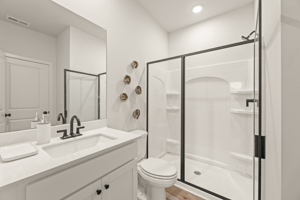 A bathroom with a glass shower.