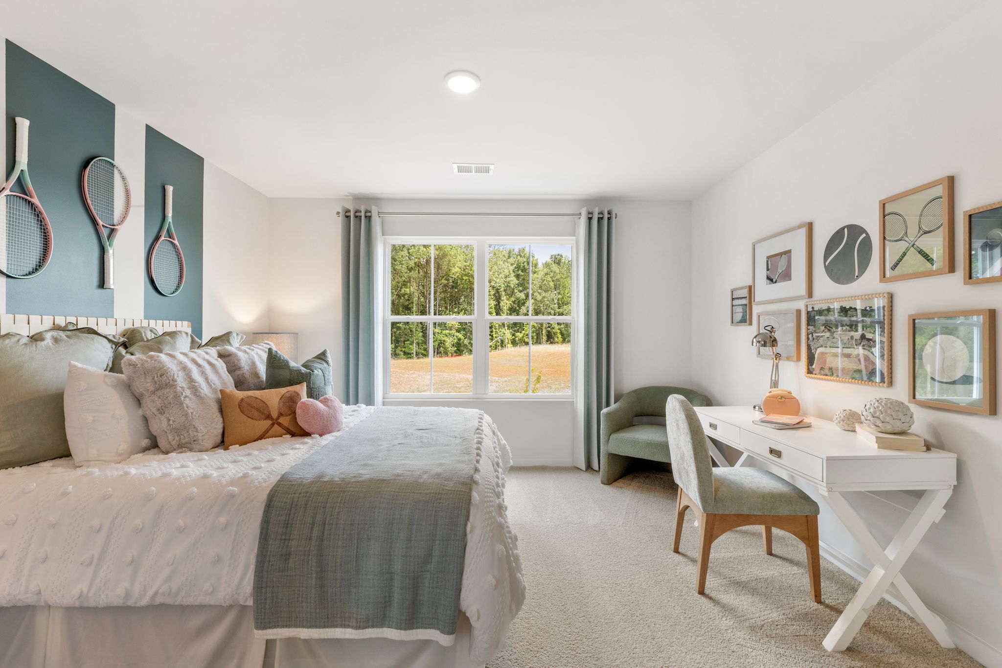 A bedroom with a bed and a table.