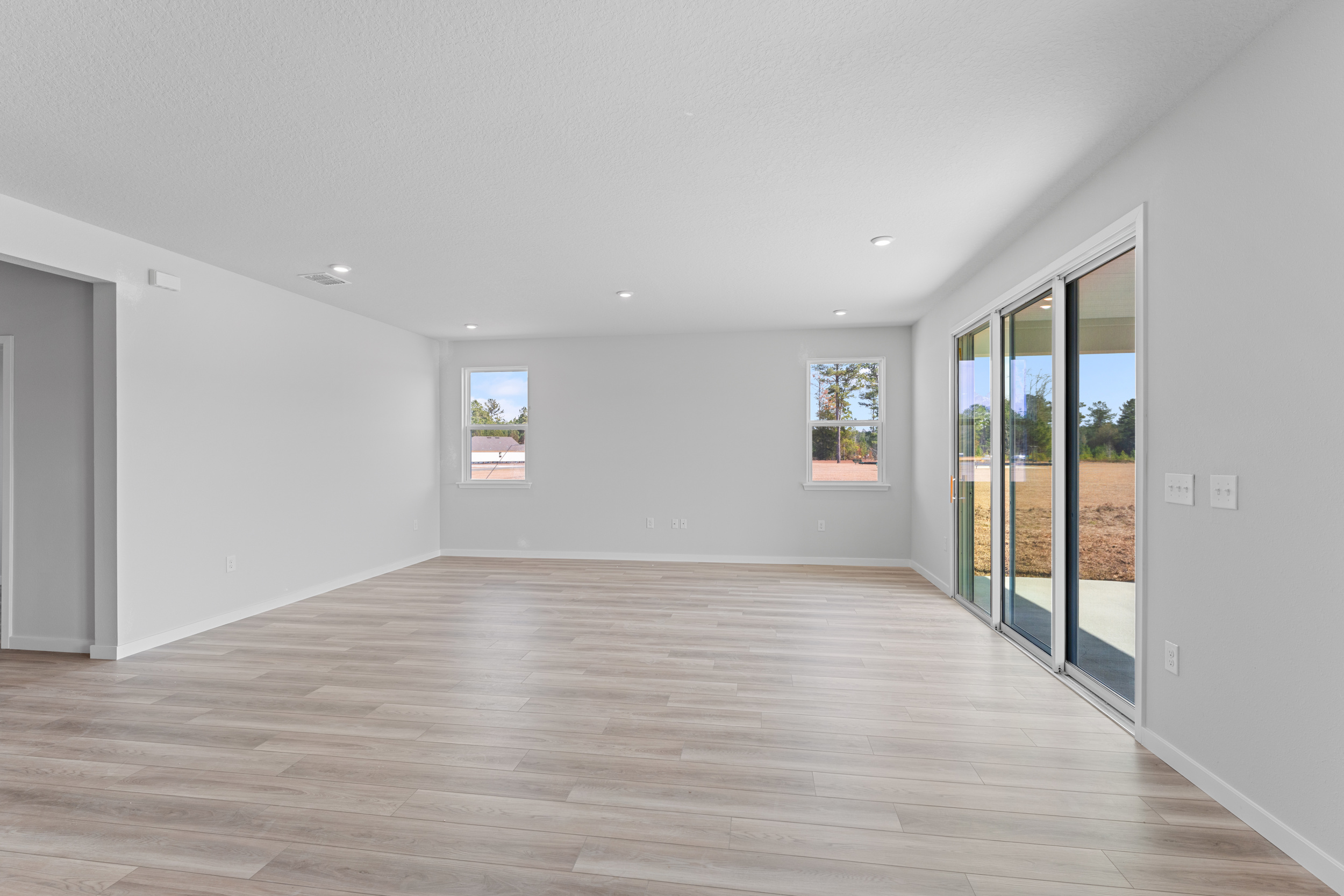 Lot 596 Open Living Area with Sliding Doors to Covered Patio at NorthShore