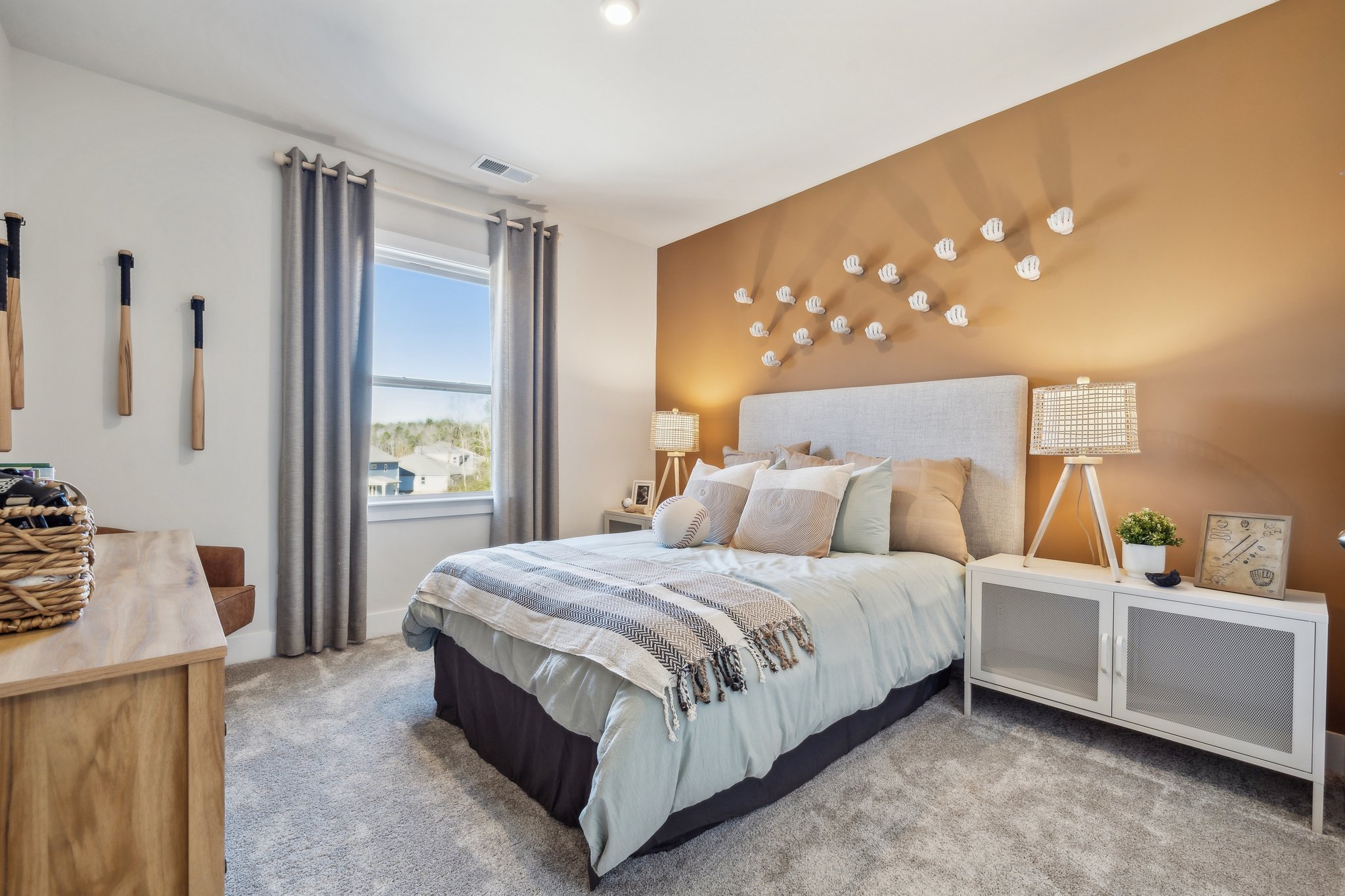 A bedroom with a bed and a window.