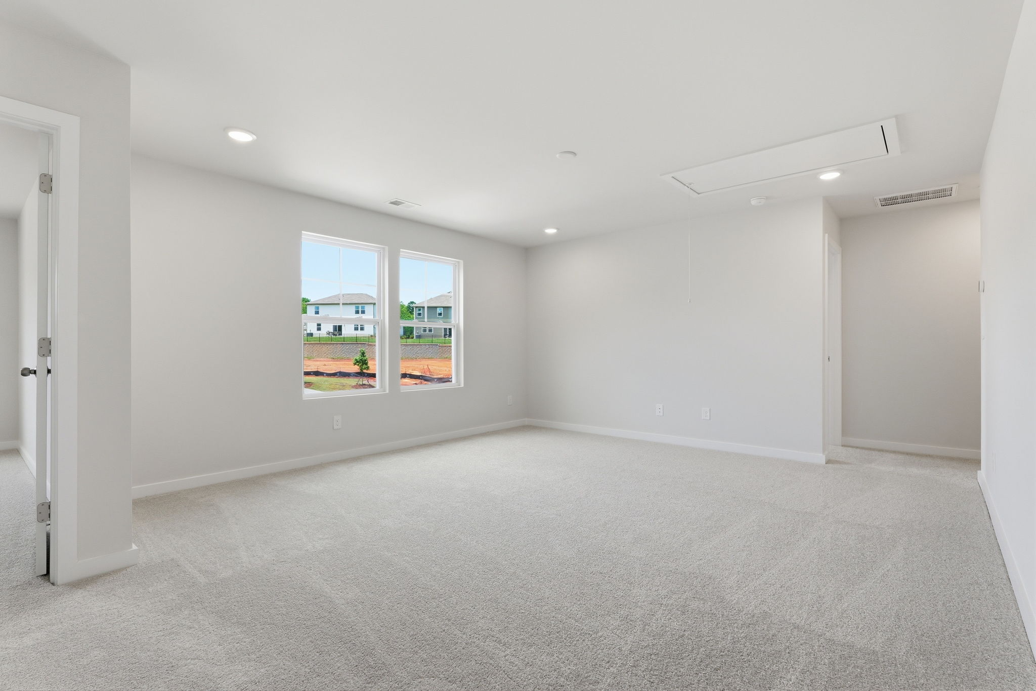 A room with a window and a door.