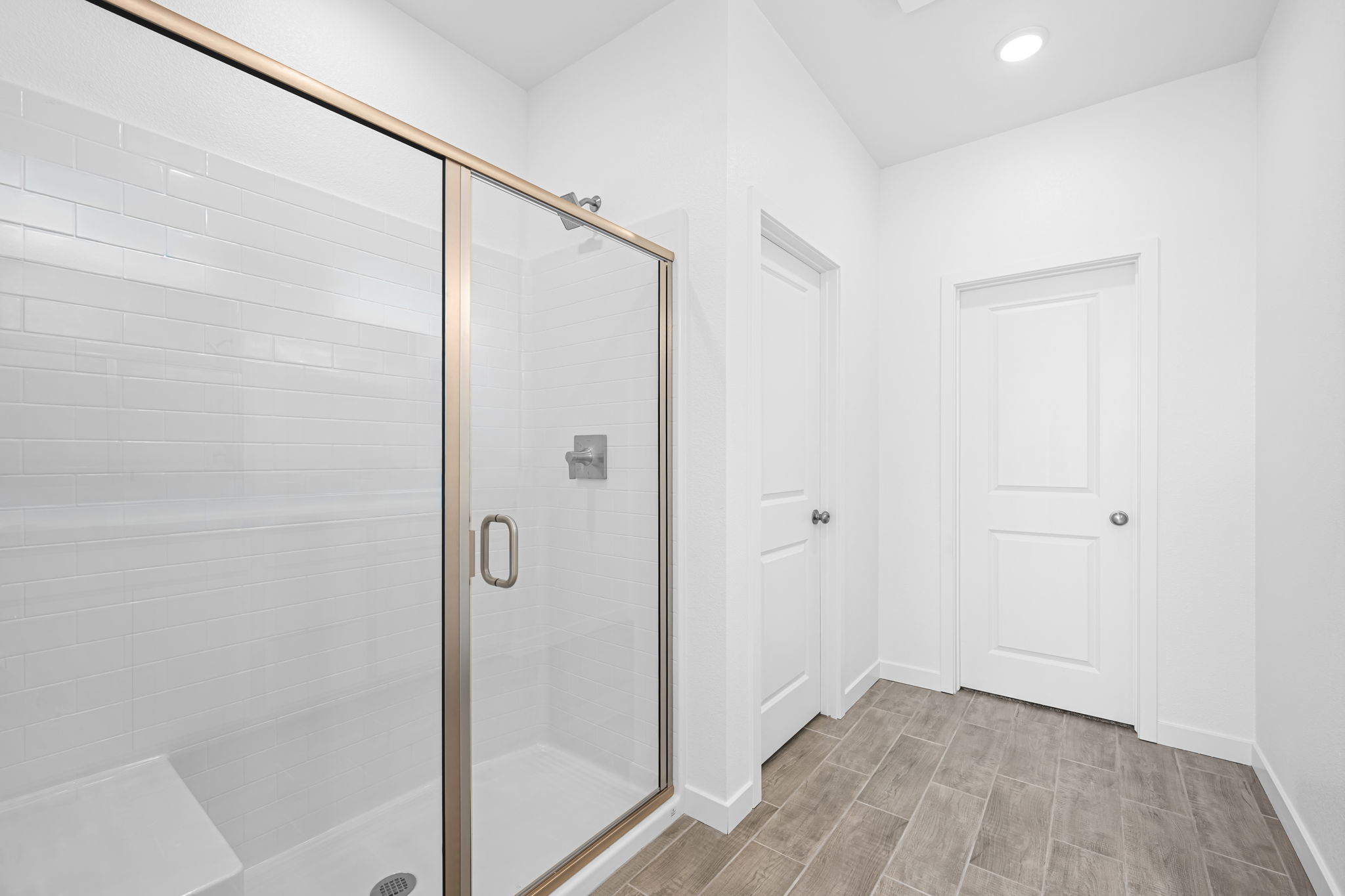 A bathroom with a glass shower.