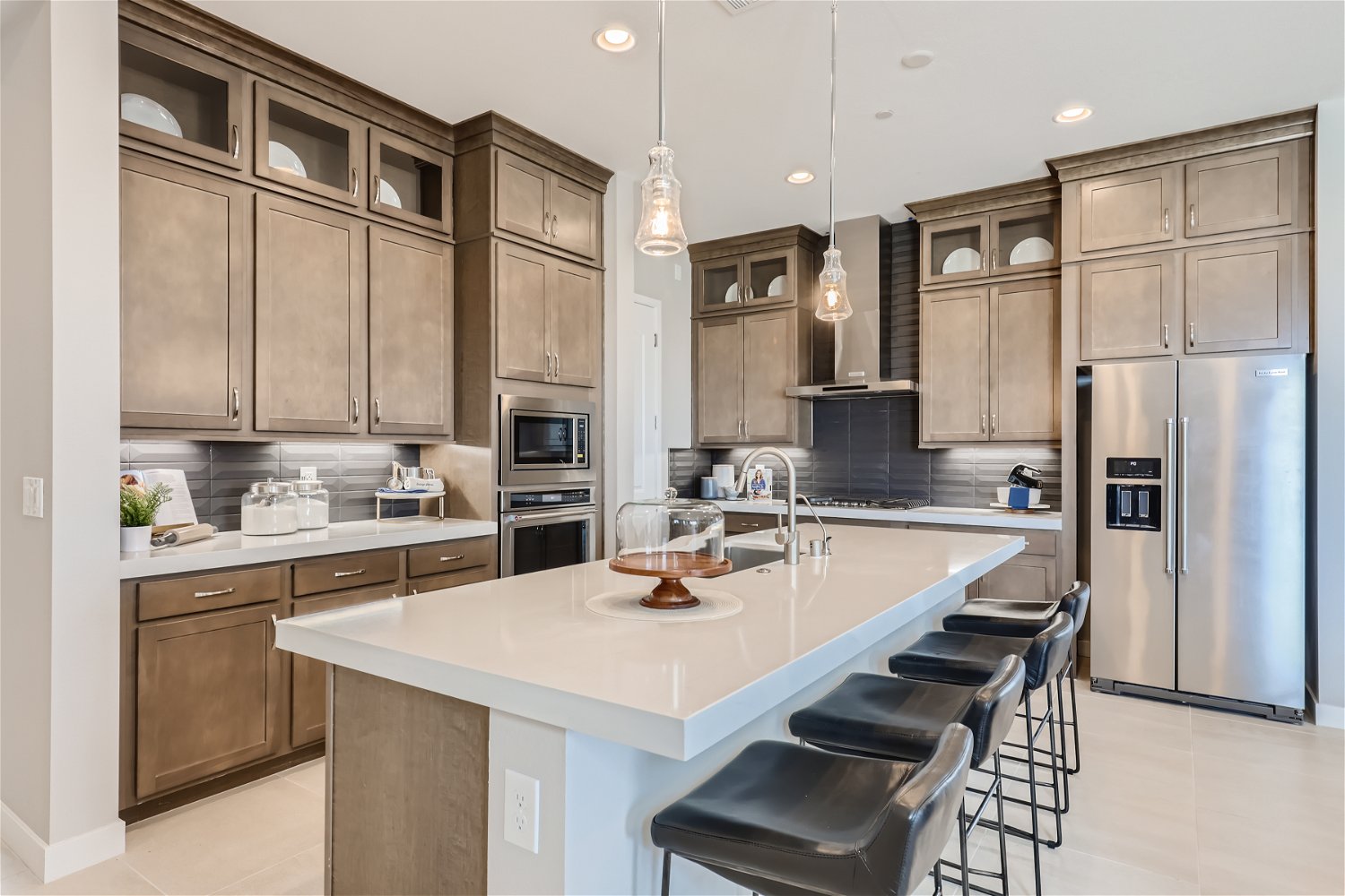 A kitchen with a marble island.