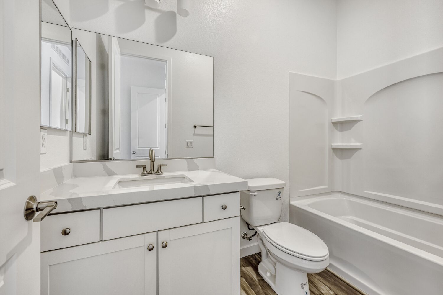A bathroom with a toilet and sink.