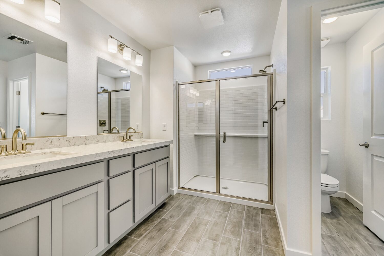 A bathroom with a glass shower.