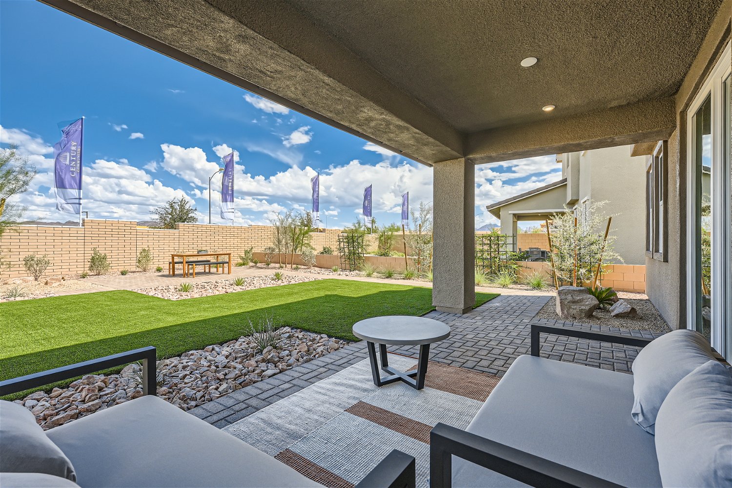A house with a patio and a pool.