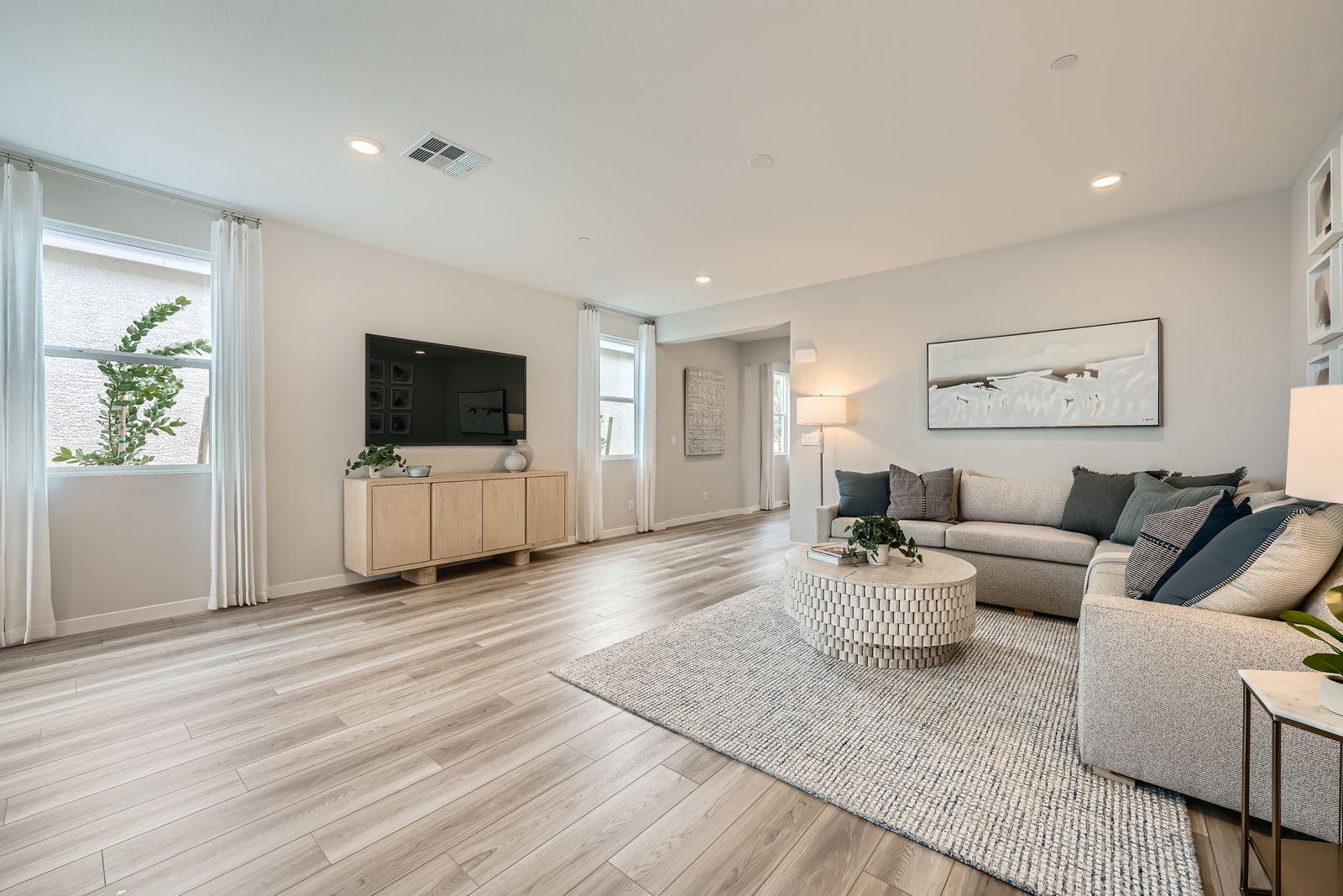 A living room with a wood floor.