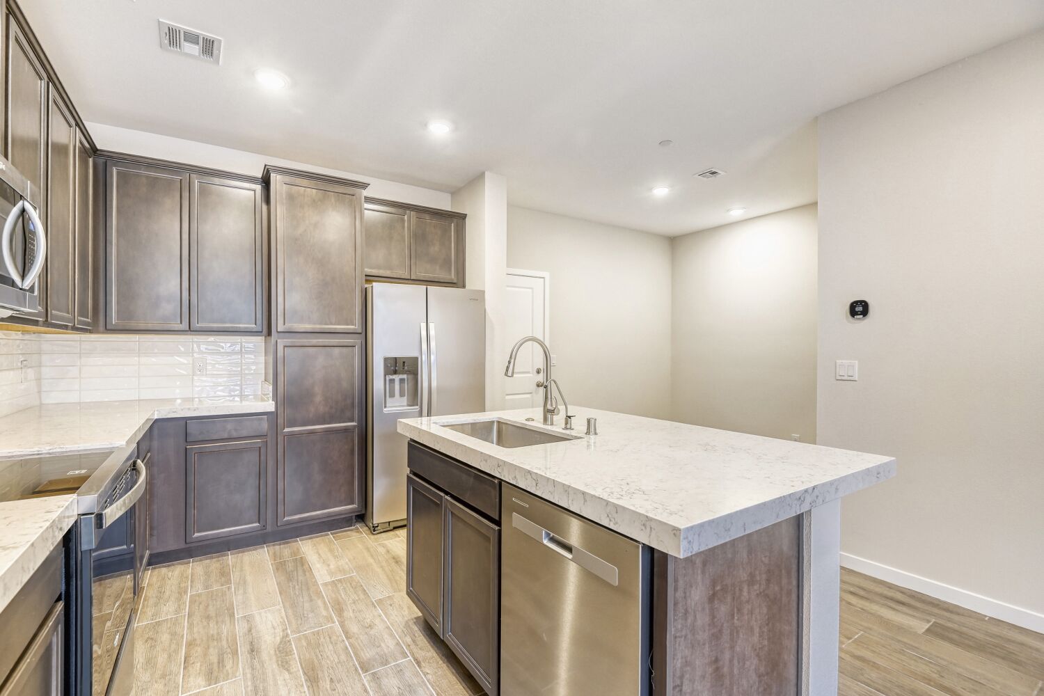 A kitchen with stainless steel appliances.
