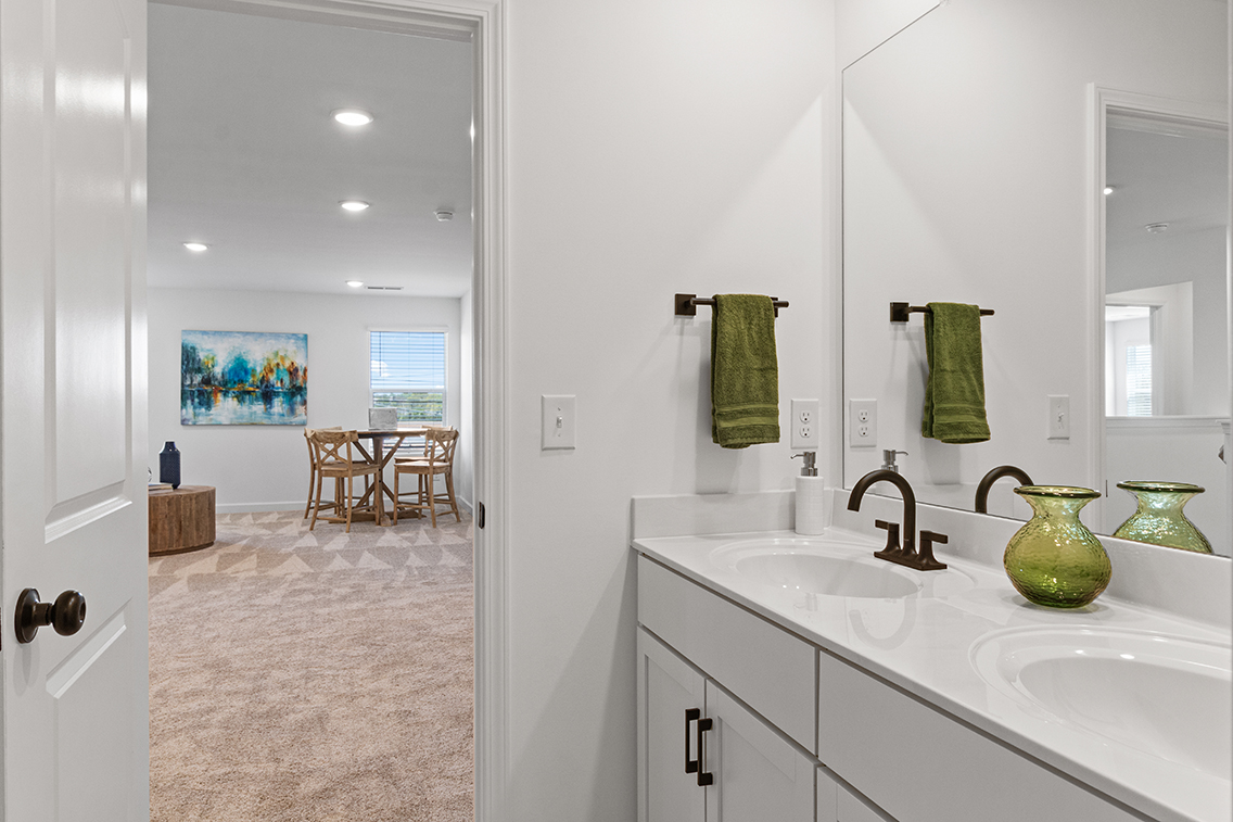 A bathroom with a sink and a mirror.
