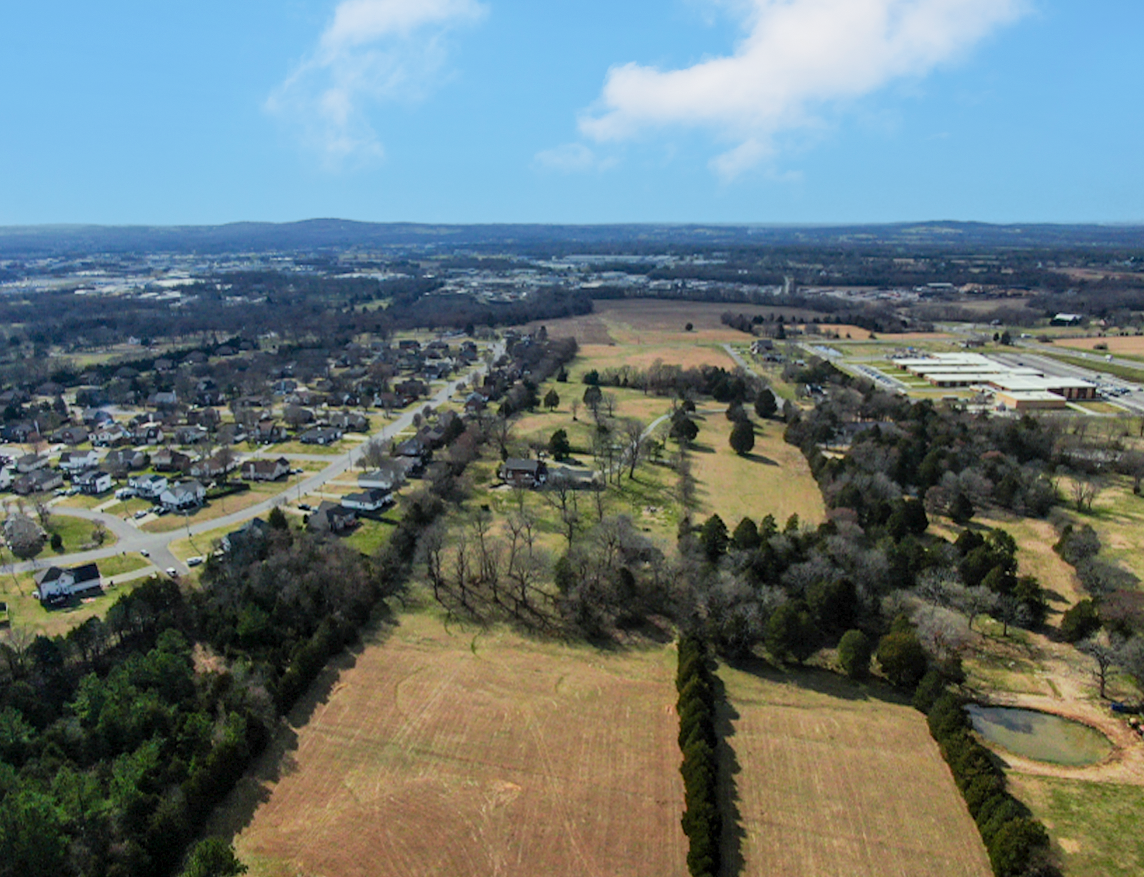 A landscape with trees and buildings.