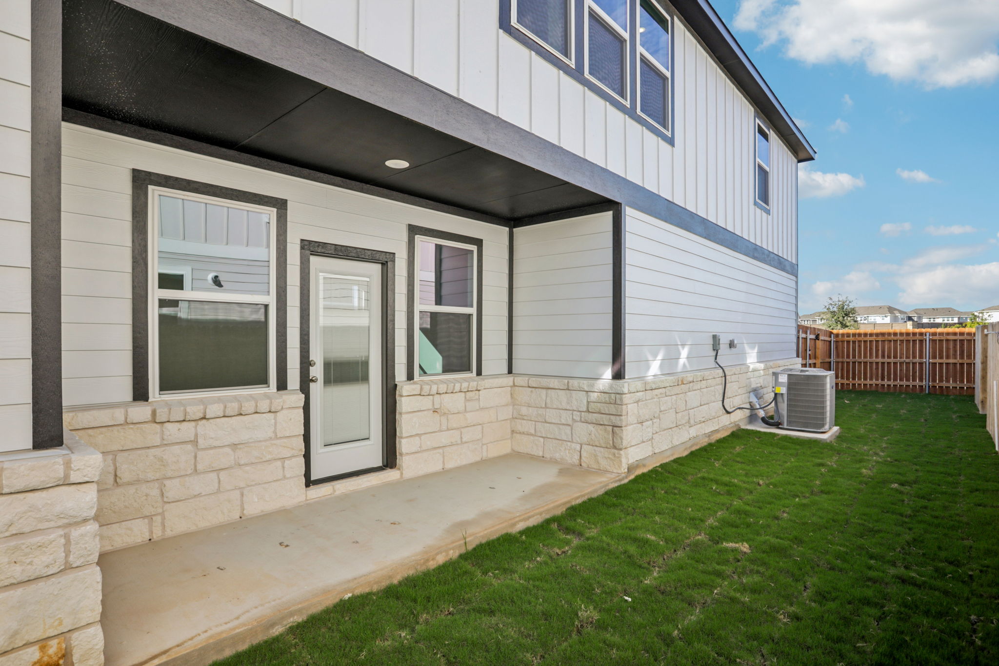 A house with a grass yard.