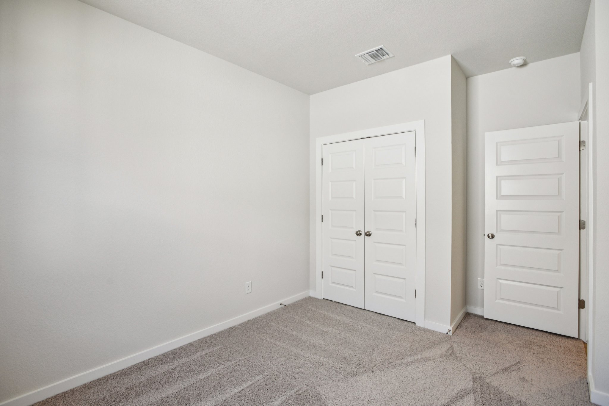 A room with white doors.
