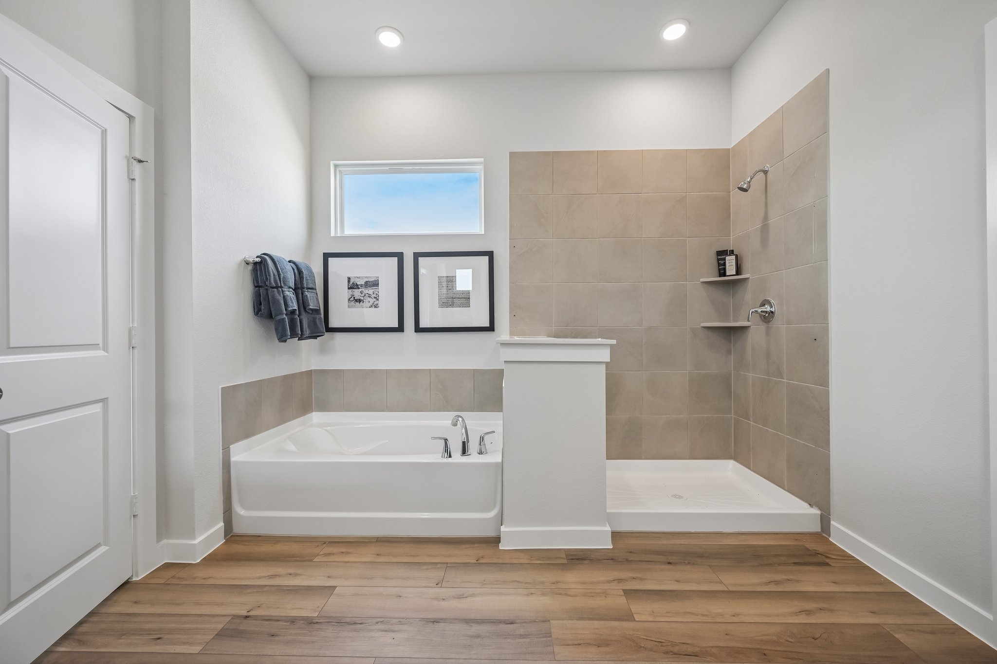 A bathroom with a tub and a sink.