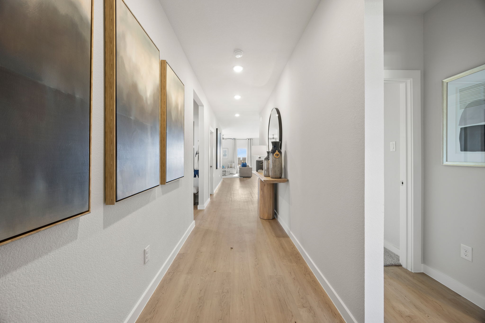 A long hallway with white walls.