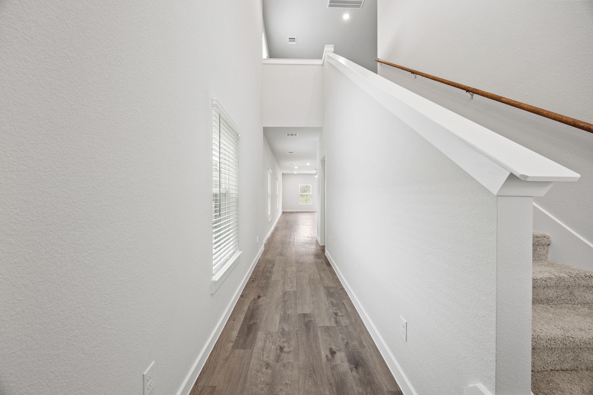 A hallway with white walls.