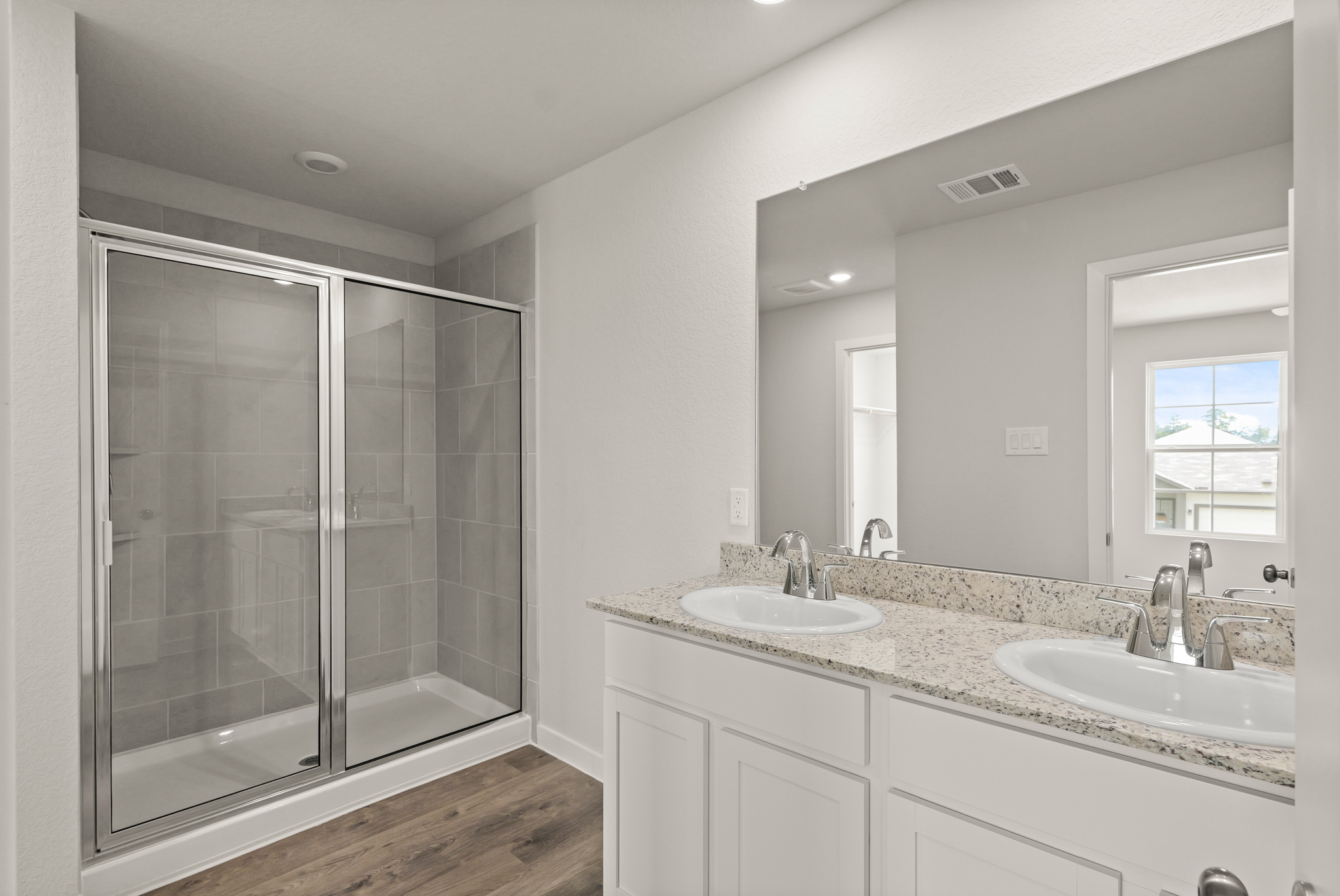 A bathroom with a glass shower.