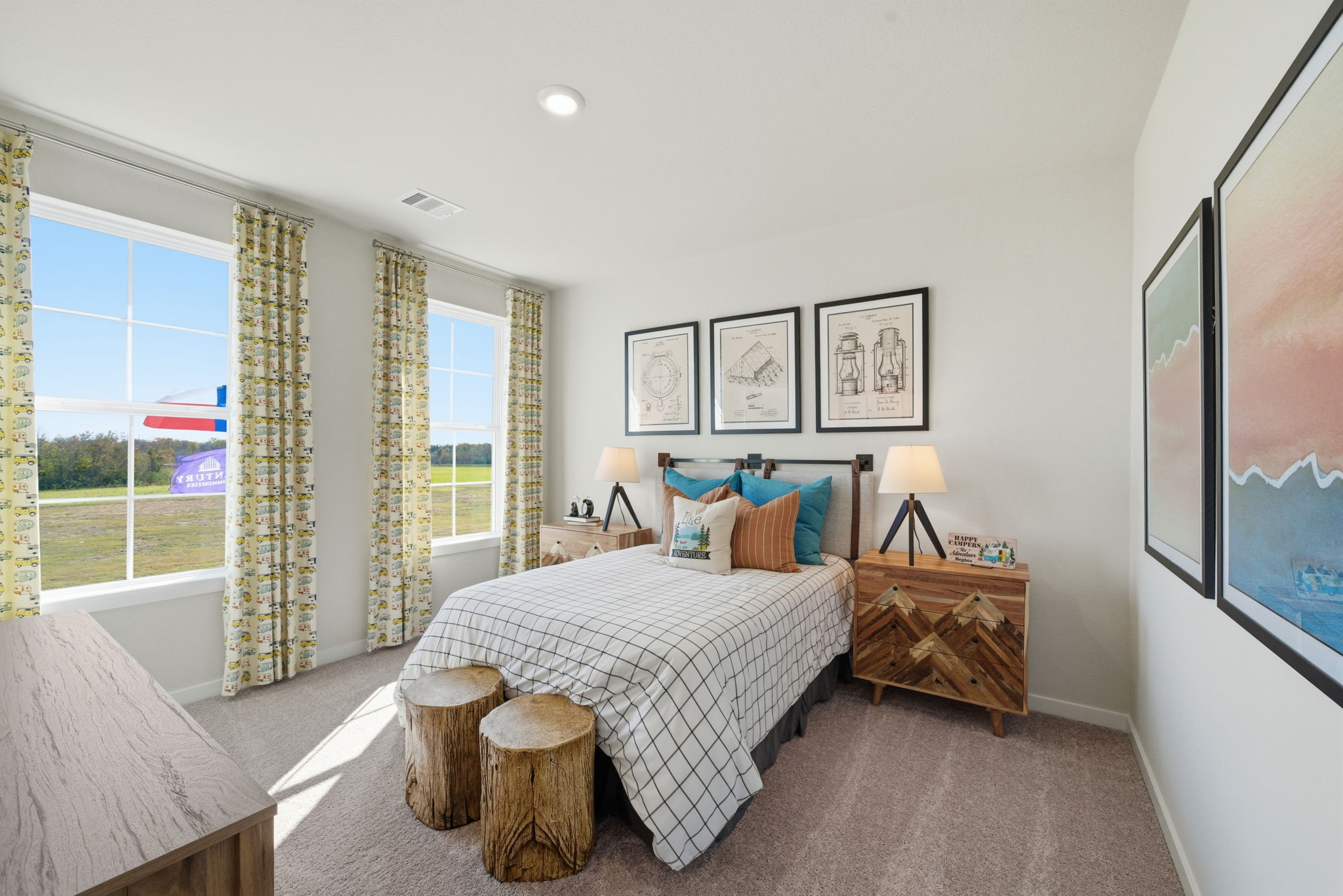 A bedroom with a large window.