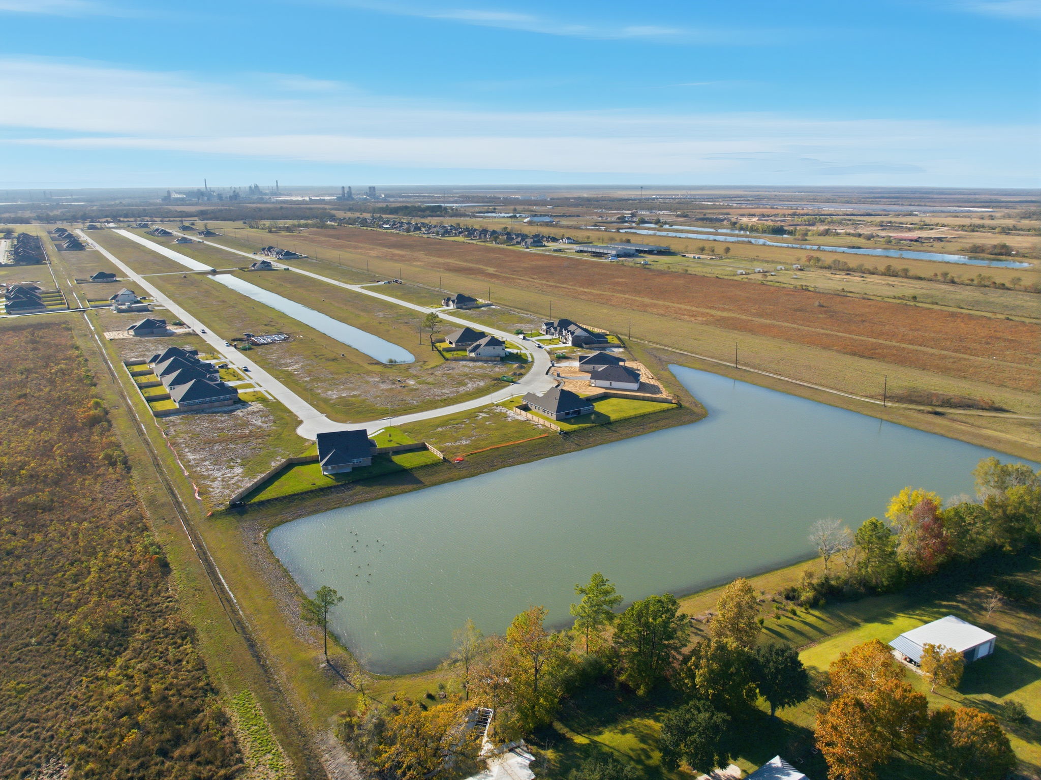 A river with a bridge and buildings.