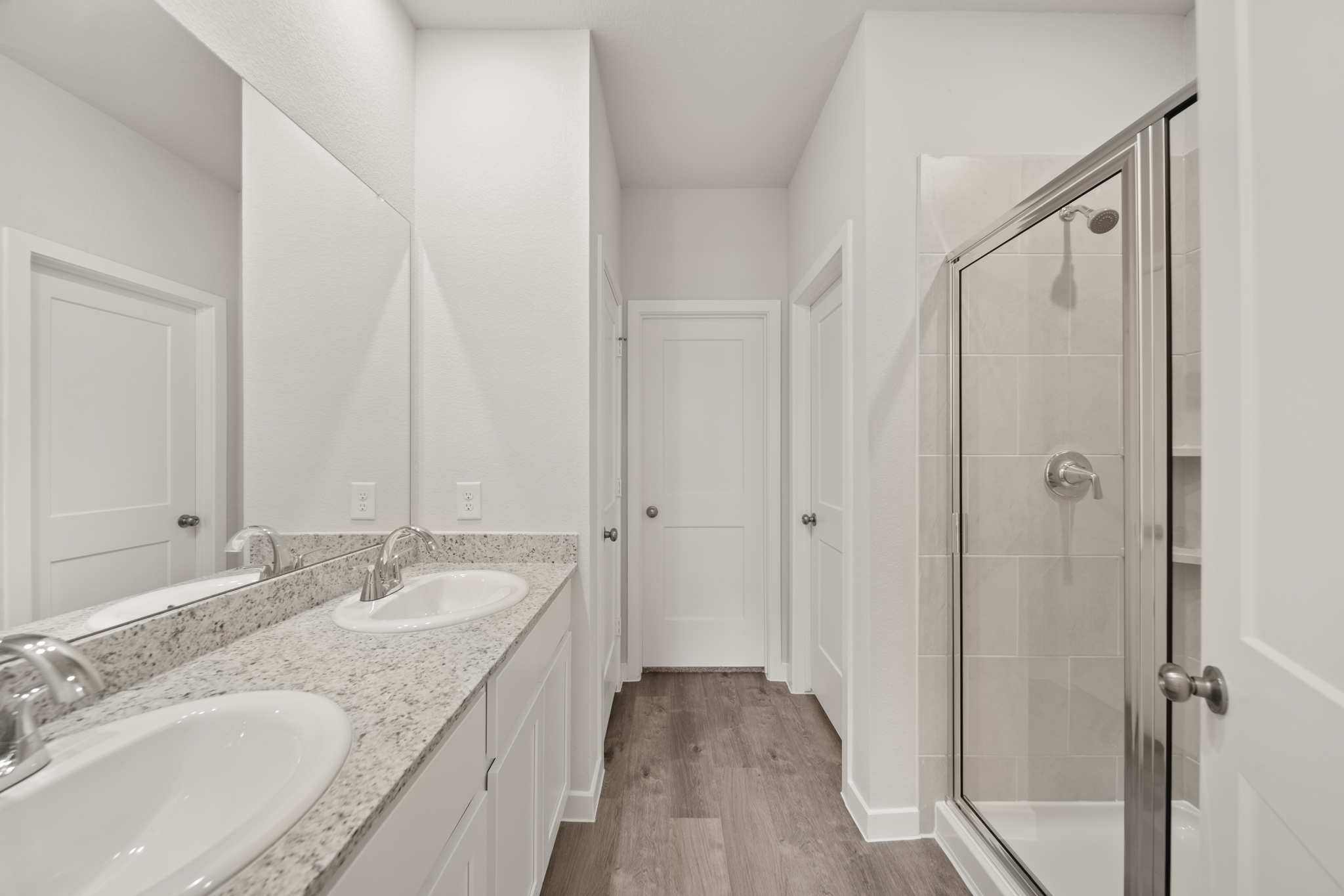 A bathroom with a glass shower.