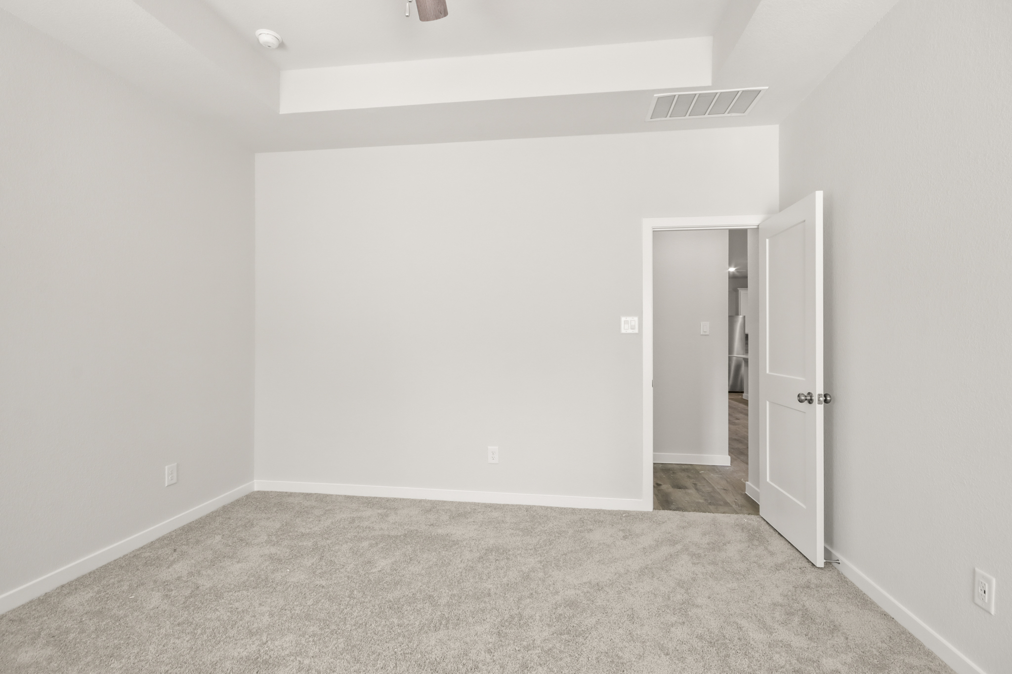 A room with a door and a window.