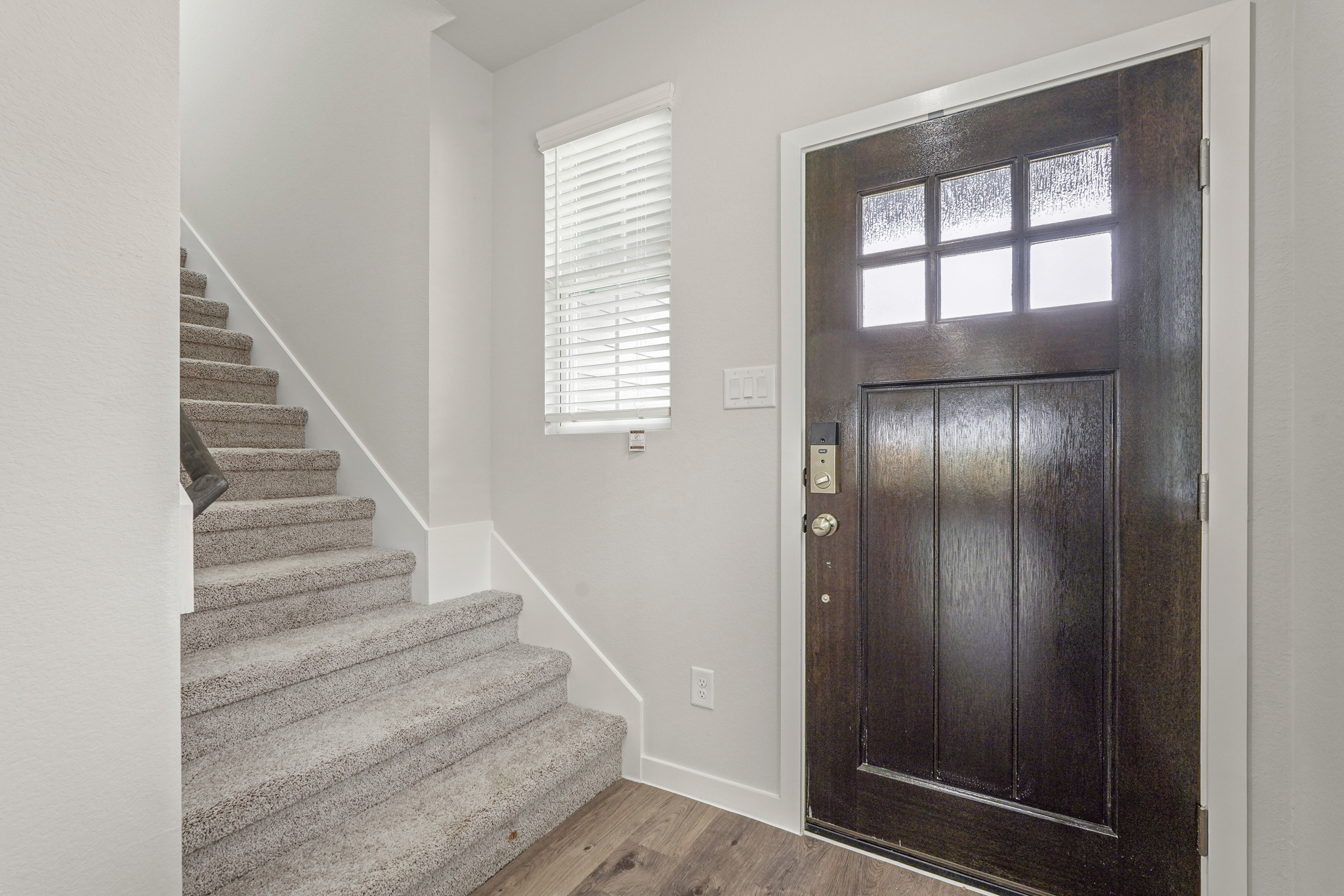 A staircase leading to a door.