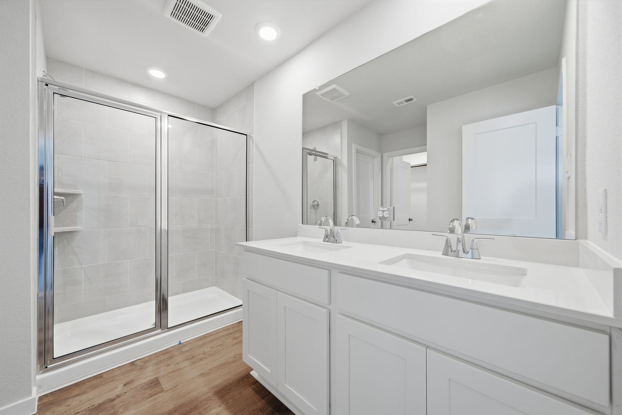 A bathroom with a glass shower.
