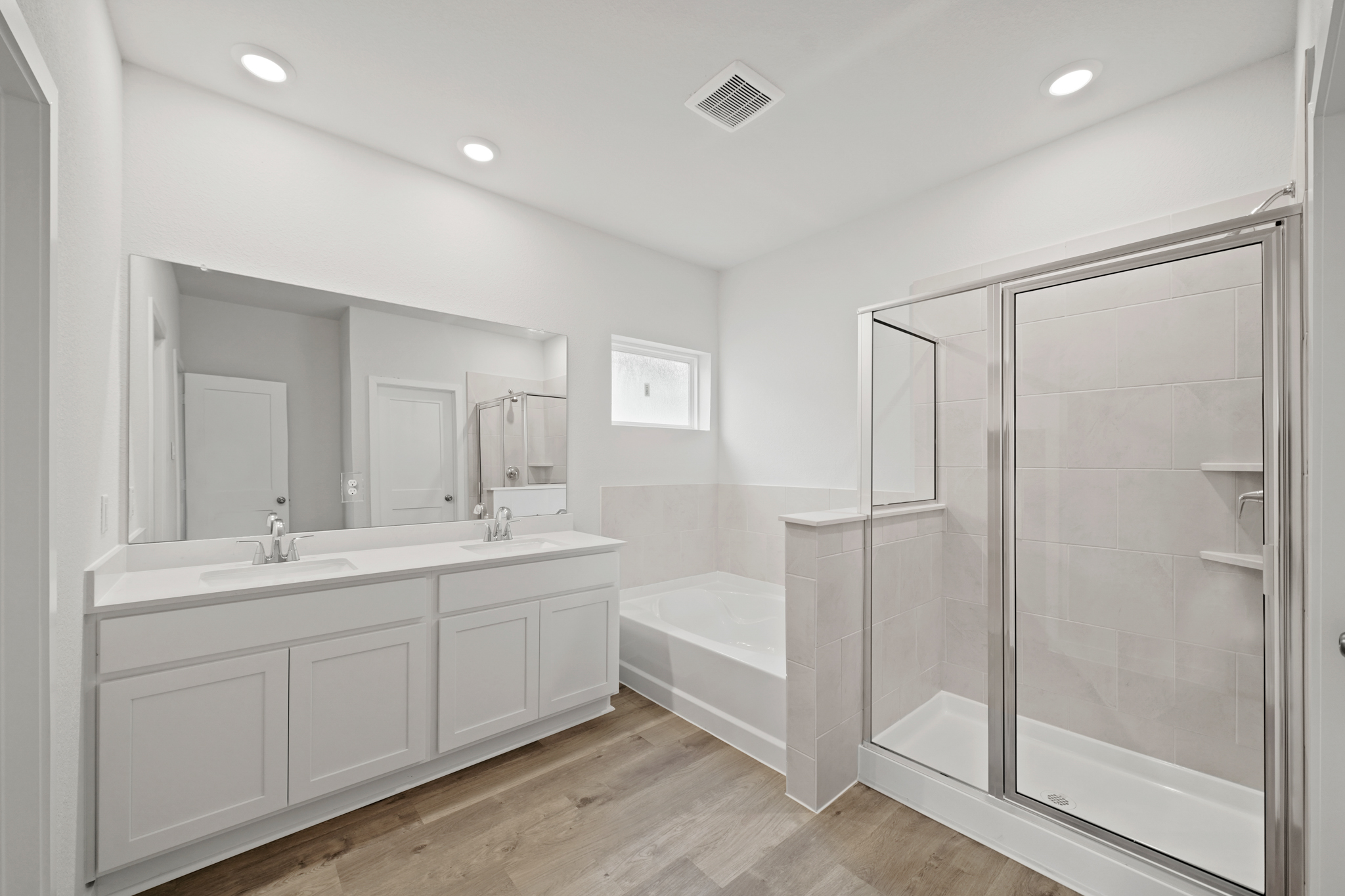 A bathroom with a glass shower.