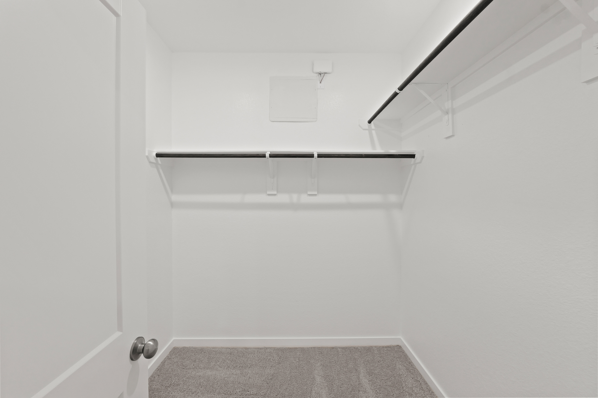 A white room with a white wall.