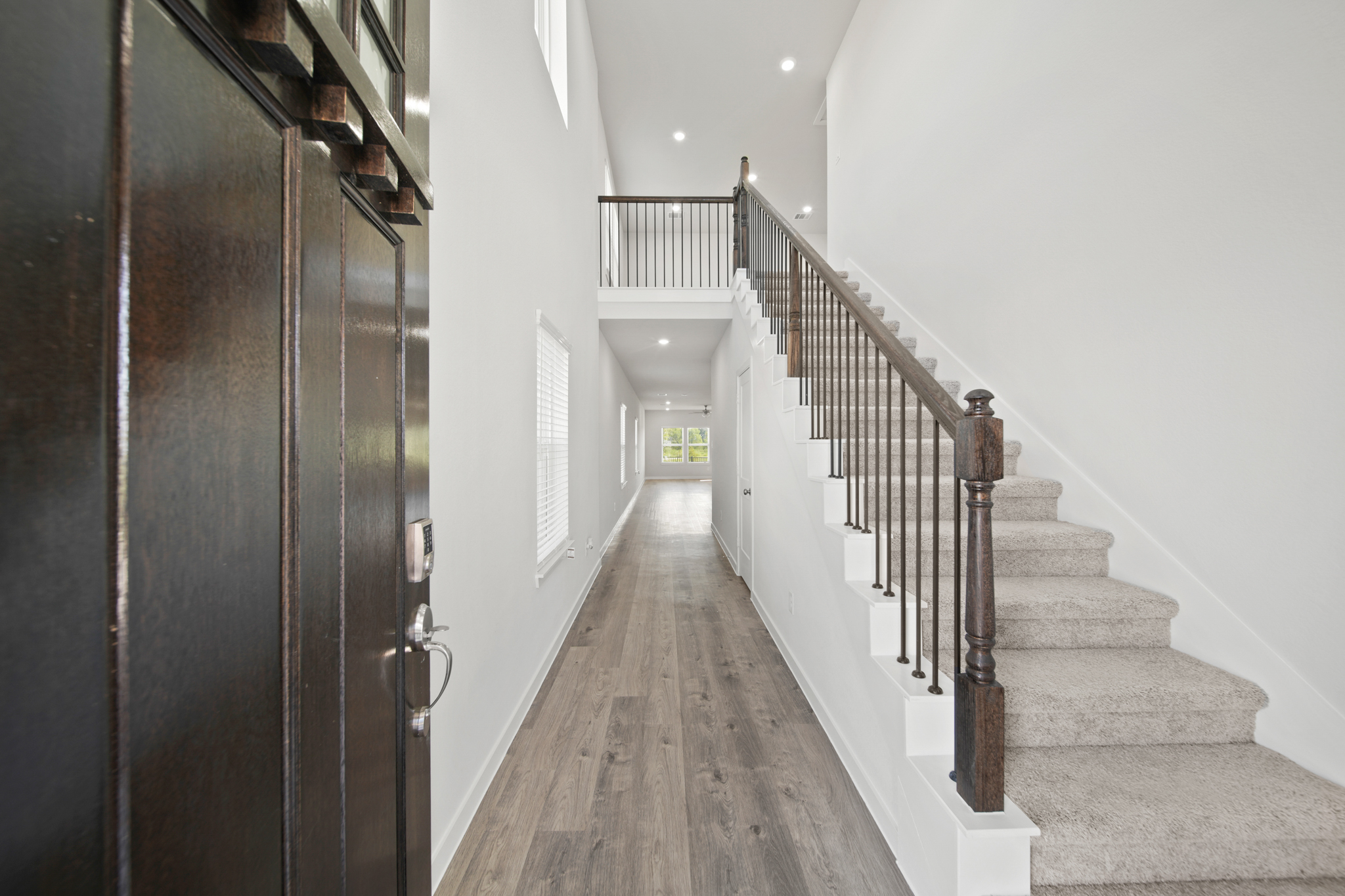 A long hallway with a railing.