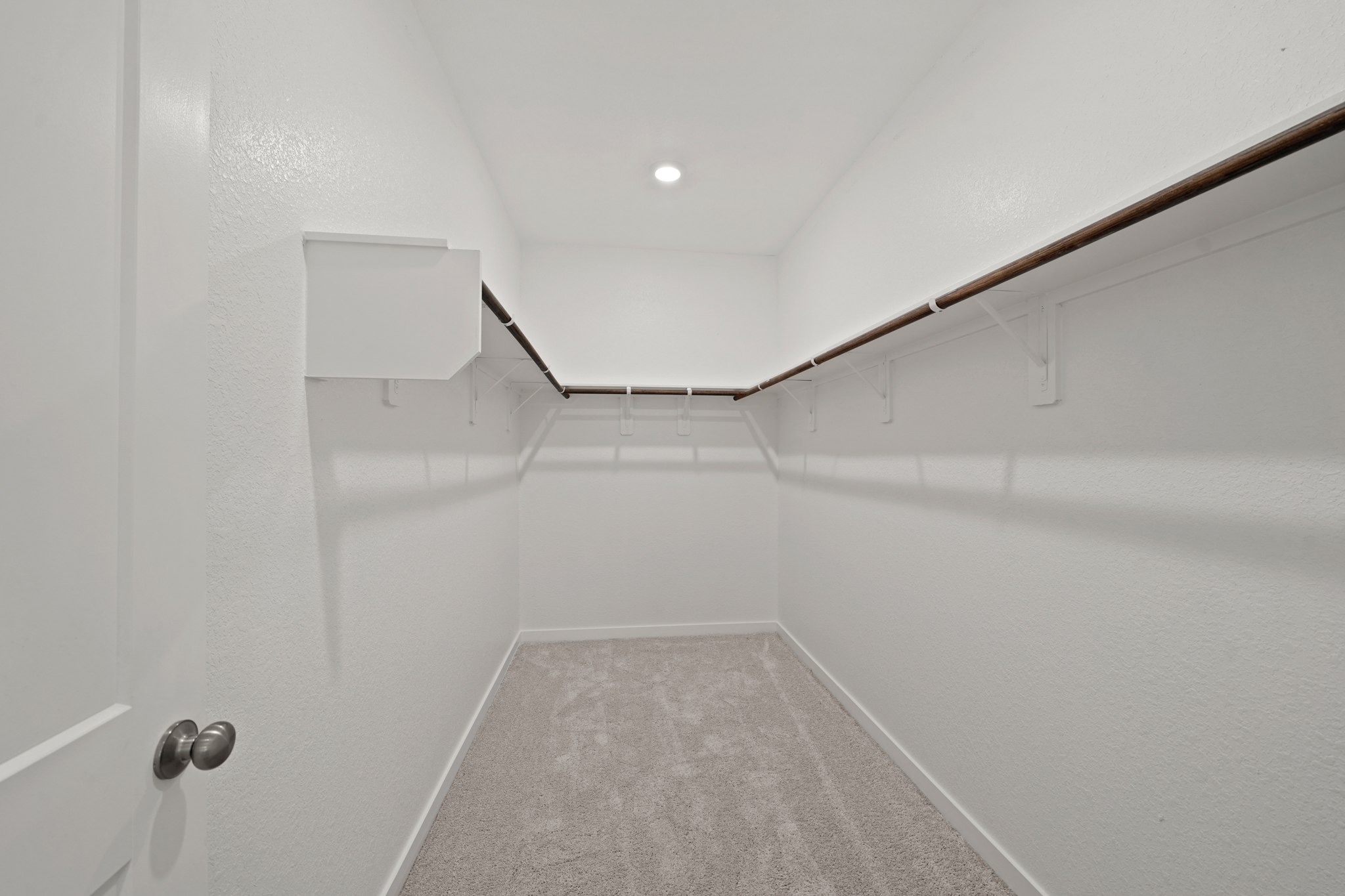 A white tiled hallway.