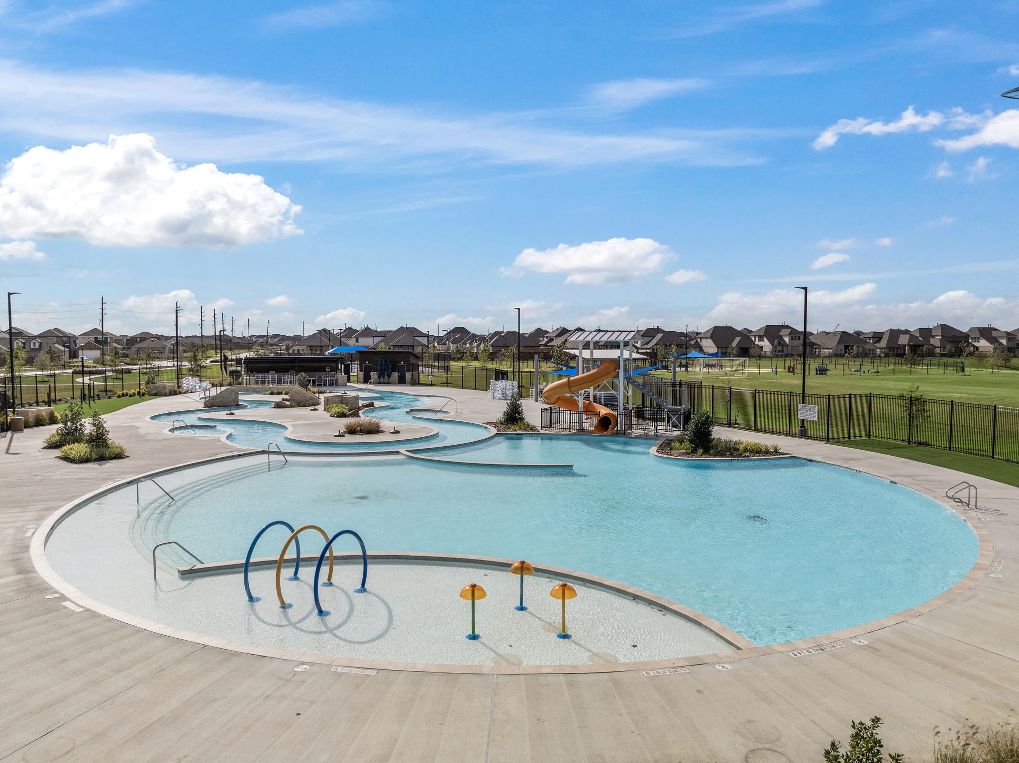 A swimming pool with a slide.