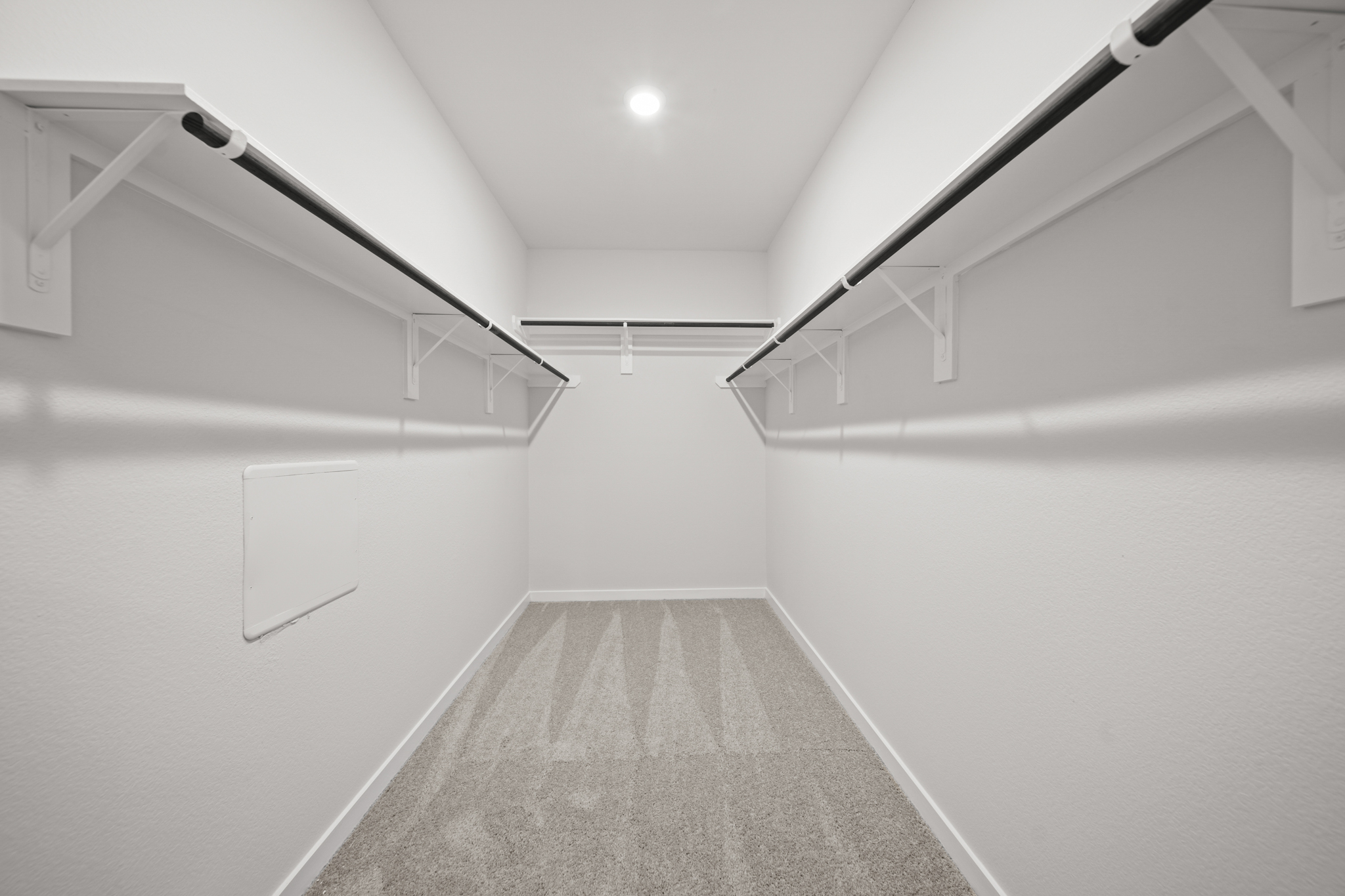 A hallway with white walls.